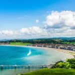 Beautiful Summer Day looking over the pier in Llandudno Sea Front in North Wales, United Kingdom