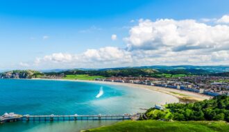 Beautiful Summer Day looking over the pier in Llandudno Sea Front in North Wales, United Kingdom