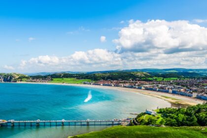 Beautiful Summer Day looking over the pier in Llandudno Sea Front in North Wales, United Kingdom
