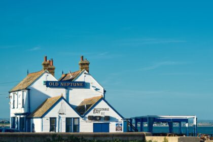 A long shot of the old Neptune pub on the beach of Whitstable, Kent.