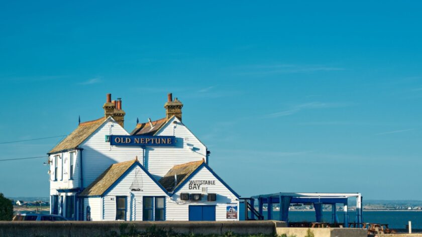 A long shot of the old Neptune pub on the beach of Whitstable, Kent.