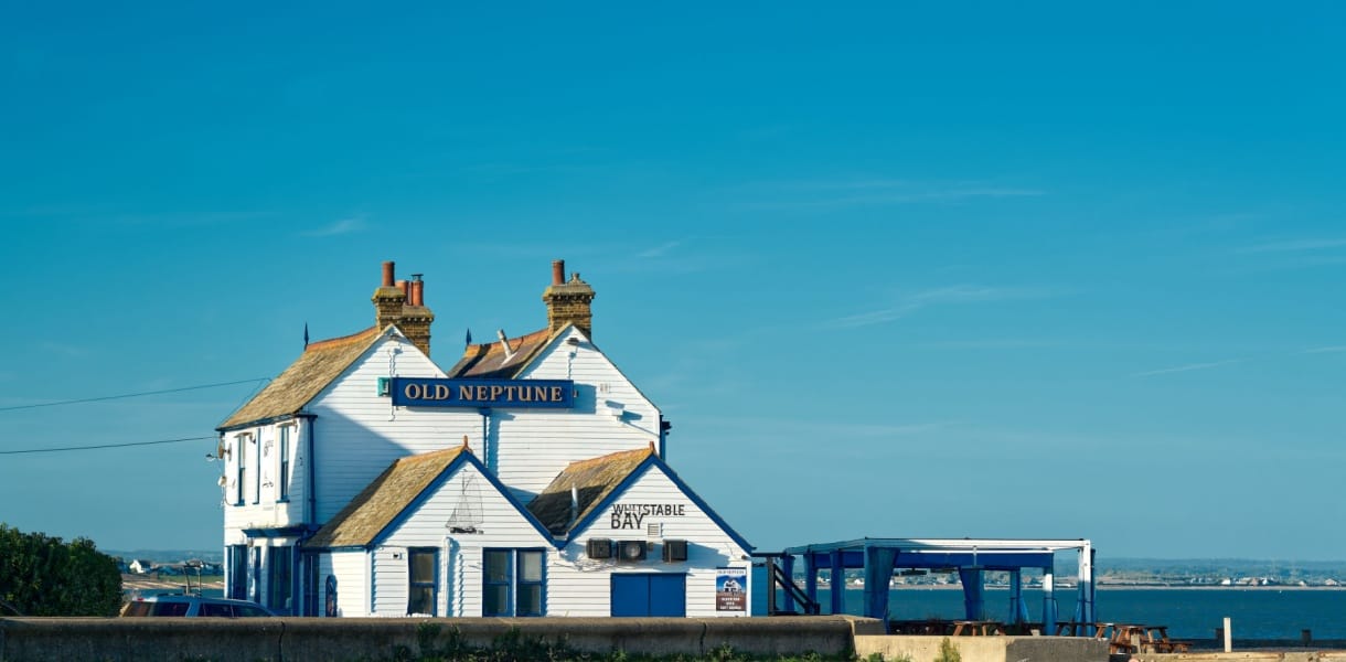 A long shot of the old Neptune pub on the beach of Whitstable, Kent.