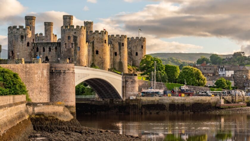 Sunset over the Conwy Estuary and Castle with Snowdonia mountains in the background