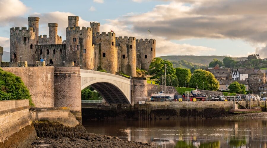 Sunset over the Conwy Estuary and Castle with Snowdonia mountains in the background