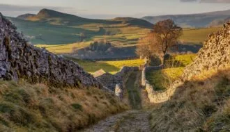 Yorkshire Dales landscape with limestone dry stone wales and an unpaved track