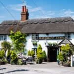A traditional thatched pub called the Waterloo Arms in Lyndhurst in the New Forest, England