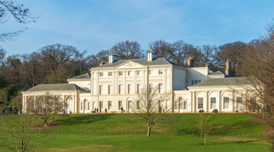Kenwood House, a grand 18th-century stately home with white neoclassical façade, set in green parkland on Hampstead Heath in London